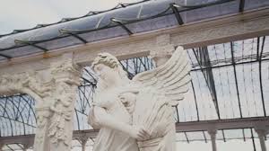 White Angel Statue In The Garden Of