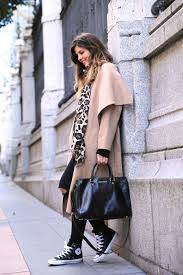 Add some accessories in this case a scarf to complete. Natalia Cabezas Is Wearing A Camel Coat From Zara Black Jeans From Asos Leopard Print Scarf Bag From Michael Kors And Black Converse Just The Design