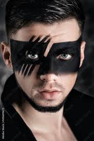 makeup man with black painted mask