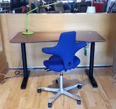Just press a button and the desk moves up or down at 2 inches per second. The Sit Stand Revolution The Century House Madison Wi