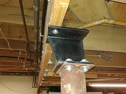 basement support pole offset from beam