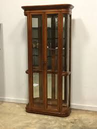 Our selection of glass curio cabinets are going fast. Mirrored And Lighted Curved Glass Curio Cabinet Invio Fine Furniture Consignment