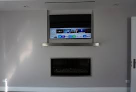Frame Tv Mounted Above Fireplace