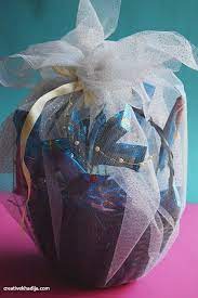 wrap a chocolate filled gift basket