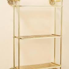 staggered gold metal shelving unit