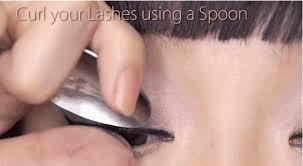 apply eye makeup using a spoon