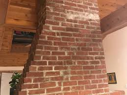 ugly uneven exposed brick chimney