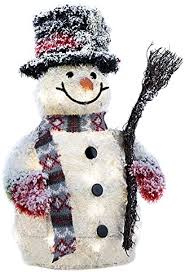 white rattan snowman holding broom