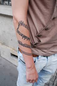 This tattoo incorporates 3d like headphones inked in black with some red detailing. 75 Best Music Tattoo Designs Meanings Notes Instruments 2019