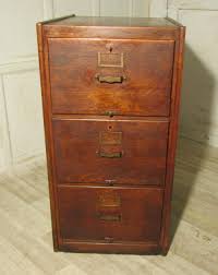 A cabinet wall, and a counter with sink and. A Large Art Deco 3 Drawer Oak Filing Cabinet 252511 Sellingantiques Co Uk