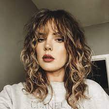 A good length is a fringe that just skims your eyebrow, but doesn't hit your eyelashes. Curly Bangs Long Layered Curly Hair Hair Styles Long Hair Styles