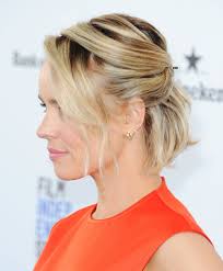 The hair around the crown is teased for an extra body, and the bottom hair is loosely twisted into a soft round bun, while the bangs are slightly curled to bring a playful element into the finished look. 12 Formal Hairstyles For Short Hair To Rock This Party Season