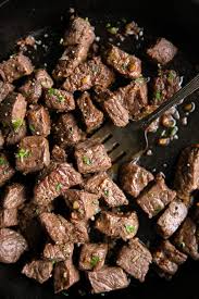 Place the foil package in a large, shallow baking pan or roasting pan. Garlic Butter Steak Bites Recipe The Forked Spoon