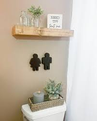 Floating Shelves Above A Toilet