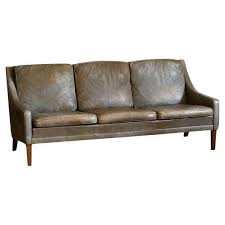 mid century leather sofa with wooden