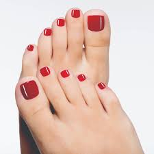 beautiful female feet with red pedicure