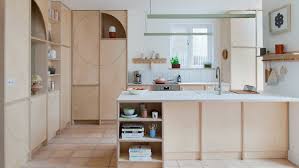 ten wood clad kitchens with warm and