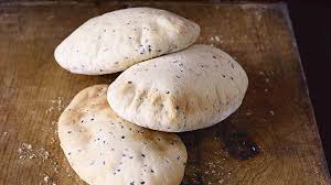 Remove the hot tray from the oven, dust with flour and place the pitta breads on it. Pitta Breads Sbs Food