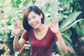 Beautiful portrait young asian woman smiling waving hand in garden - stock  photo | Crushpixel