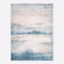sunset lake blue beige faded wool rug