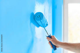 Male Hand Painting Wall With Paint