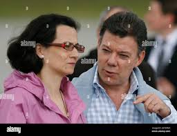 Colombian politician Clara Rojas (L) talks with Colombia's Defense Minister  Juan Manuel Santos at military airport in Bogota January 13, 2008. The  Revolutionary Armed Forces of Colombia, or FARC, rebels on January