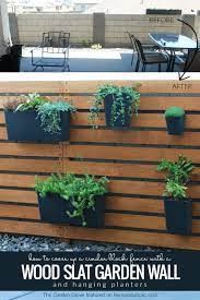 diy wood slat garden wall with planters