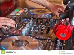 Dj Mixer With Headphones At Nightclub Dj Mixes The Track