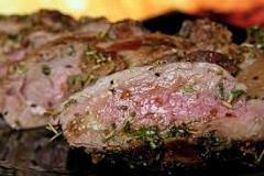What are the popular game meats used in South African cooking?