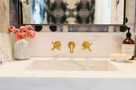 White Marble Powder Room Sink With Gold