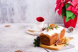 Combine dried fruits, butter, sugar, honey, orange juice and baking soda in a large saucepan. Premium Photo Fruit Loaf Cake Dusted With Icing Nuts And Dry Orange On Stone Christmas And Winter Holidays Homemade Cake