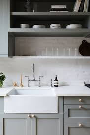 An ikea vimmern kitchen faucet is fixed in front of a window partially framed by cream tiles with black grout and is paired with an ikea. 8bpbhjekp Km