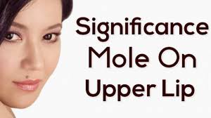 significance mole on upper lip ask my