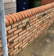 Brick Wall With Decorative Top In