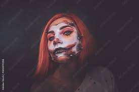 young woman with scary dead doll makeup