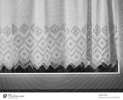 fashioned curtain behind closed window