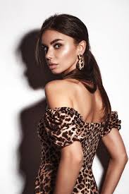 beautiful y woman in a leopard dress