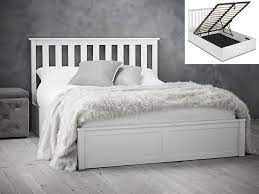 white wooden ottoman bed frame