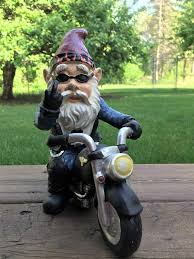 biker garden gnome statue with middle