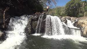 man does gainer flip off of waterfall