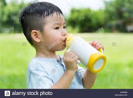 Little boy drink with his water bottle Stock Photo - Alamy