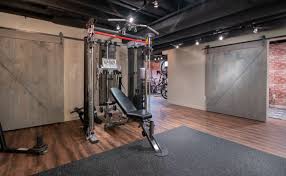 Rubber flooring, overhead lighting, and mirrors will help keep the space open and inviting! Maple Basement Remodel Home Gym Medfield Massachusetts Industrial Keller Boston Von Masters Touch Design Build Houzz
