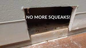 fix floors that squeak near a wall