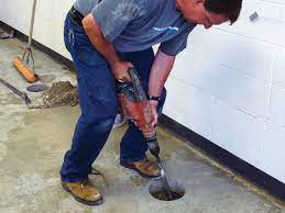 settling concrete floor slab repair