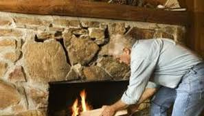 rustic mantel on a stone fireplace