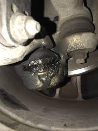 Noticed this while changing my oil. My lower ball joint is leaking. Does it  need to be replaced immediately and is replacing them expensivepain in the  ass? : r350z