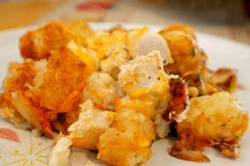 In a large bowl mix together cooked chicken, sour cream, cream of chicken soup, dry ranch dressing mix, crumbled bacon and cheese. Tater Tot Casserole Ala Mom