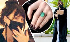 Dakota johnson is quickly becoming something of a hollywood it girl: Dakota Johnson Fuels Engagement Rumors With Chris Martin By Wearing A Large Emerald Ring Daily Mail Online