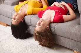 Female teenager outdoor with longboard. Happy Teen Girls Lying On Couch Upside Down Listening To Music Stock Photo Picture And Royalty Free Image Image 6338360