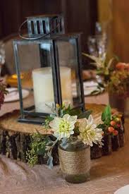 The centerpieces pictured below have been designed by our brides. Rustic Elegance Danielson Weddings Rustic Lantern Centerpieces Rustic Wedding Centerpieces Rustic Wedding Centerpieces Mason Jars